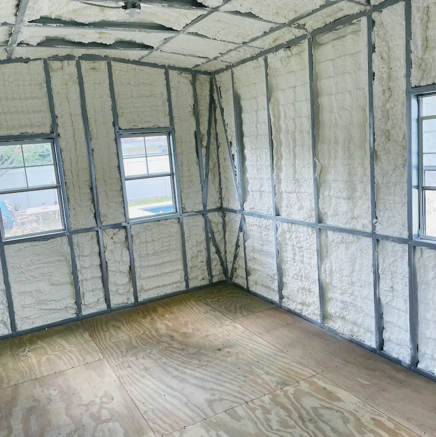 Closed-cell spray foam insulation applied to wall cavities in a residential project in Lucas